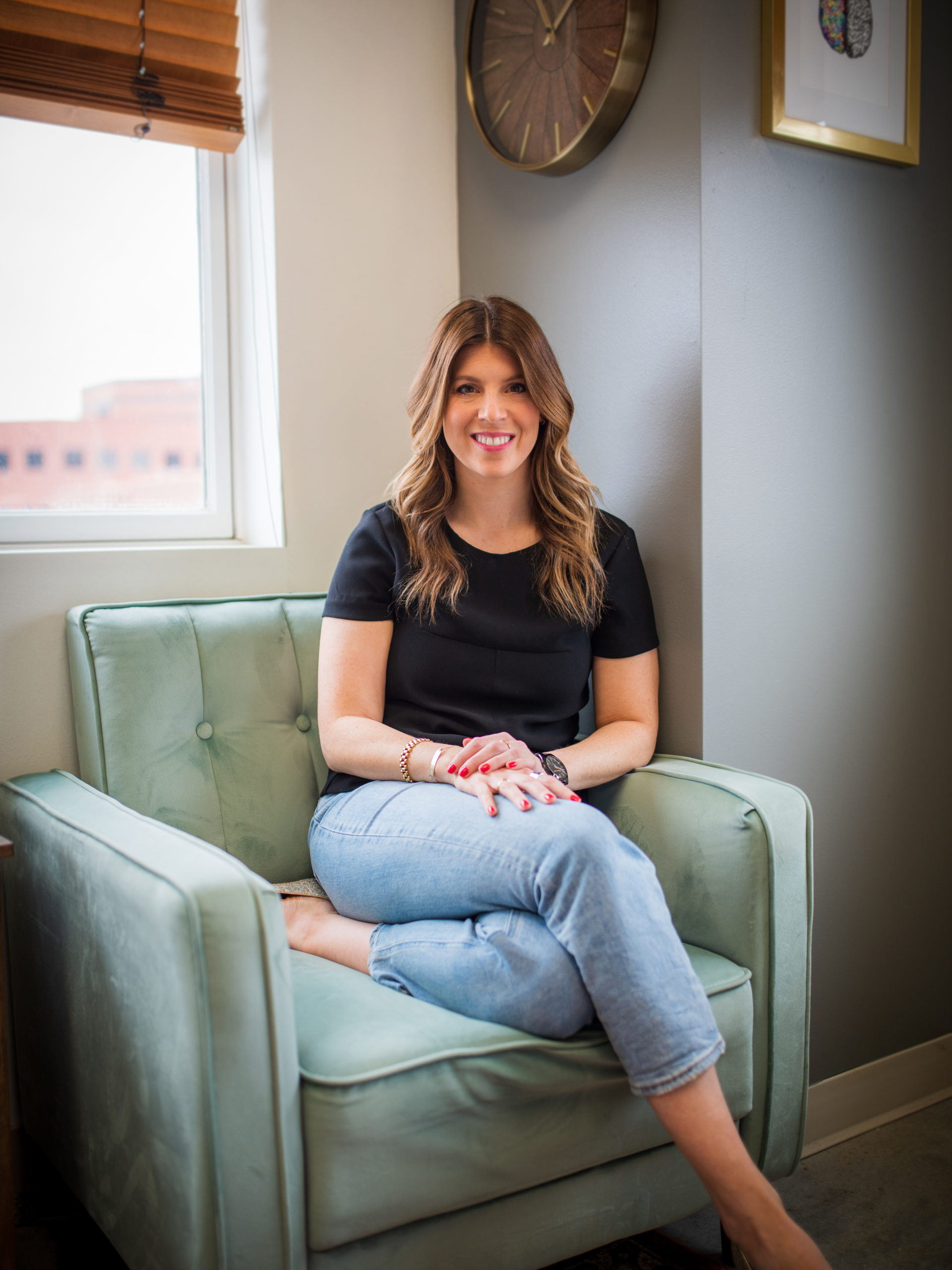 woman sitting comfortably in a chair in an office